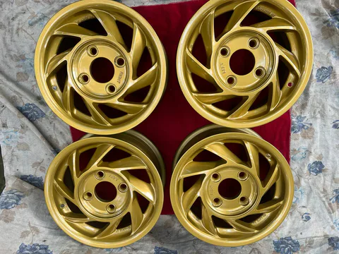 Complete directional Hiseko Aixger wheel set showing two left and two right wheels