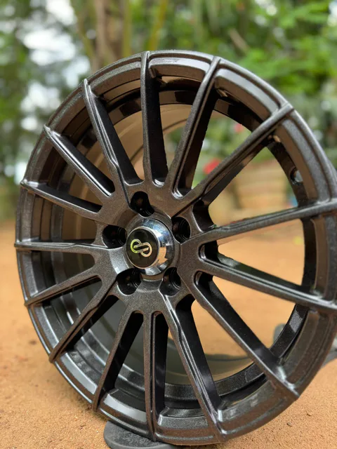 Close view of a colour-shifting metallic grey restored alloy wheel