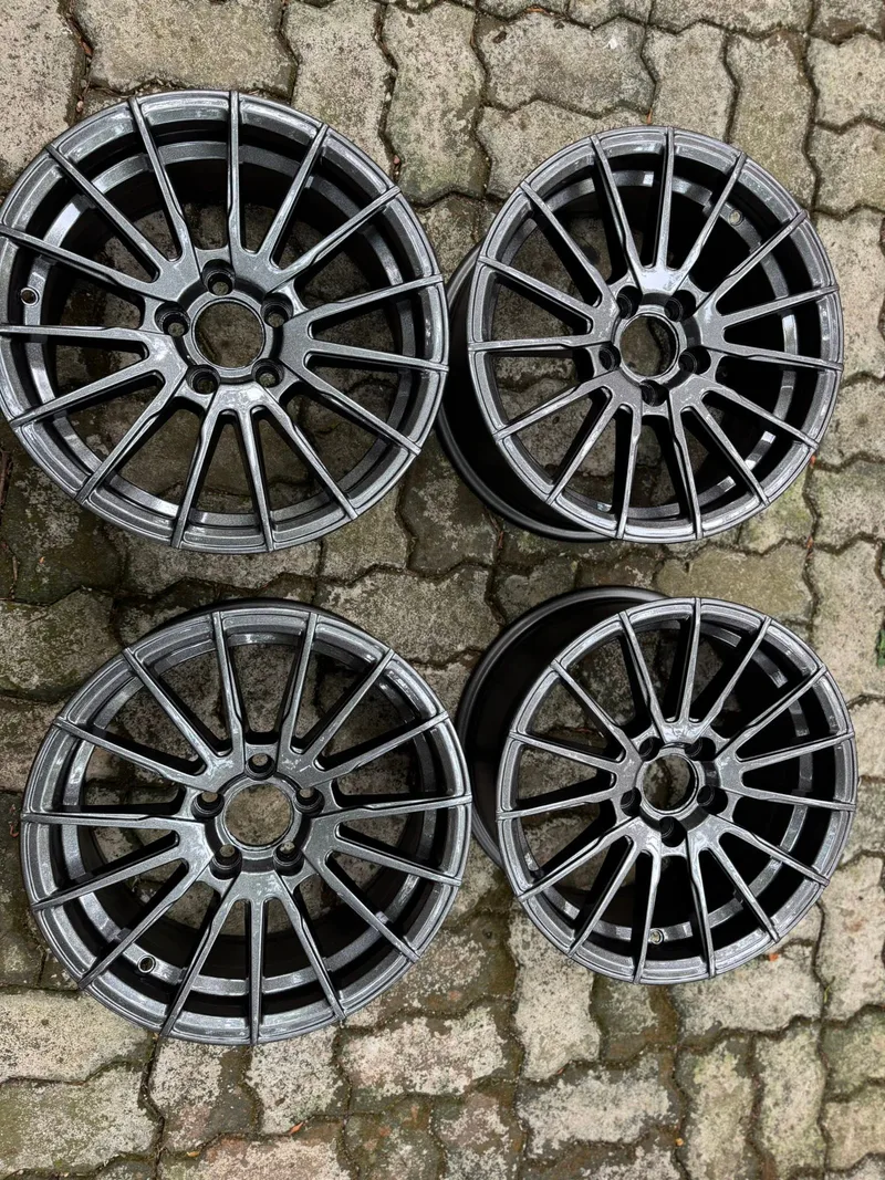 Complete set of 15-inch alloy wheels restored by Ceylon Chrome in colour-shifting metallic grey